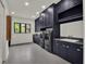 Well-equipped laundry room featuring a sink, modern appliances, and ample storage at 7615 Se 12Th Cir, Ocala, FL 34480