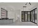 Bright and airy living space with sliding glass doors and a stylish wet bar at 7615 Se 12Th Cir, Ocala, FL 34480