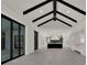 This open floor plan features high beamed ceilings and sliding glass doors at 7615 Se 12Th Cir, Ocala, FL 34480