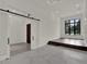Bright living room features recessed lights, stage, and sliding barn door entry to an adjacent room at 7615 Se 12Th Cir, Ocala, FL 34480
