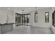 Stylish living space with modern wet bar and sliding glass doors to outdoor area at 7615 Se 12Th Cir, Ocala, FL 34480