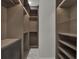 Walk-in closet with custom shelving and drawers providing ample storage space at 7615 Se 12Th Cir, Ocala, FL 34480