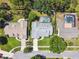 An aerial view of three homes with fenced in pools in the backyards at 7618 Majestic Pine Ct, Orlando, FL 32819
