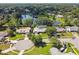 Expansive aerial shot features a residential area with multiple ponds, tree-lined streets and green yards at 7618 Majestic Pine Ct, Orlando, FL 32819