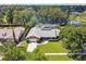 Beautiful lakeside home with lush landscaping and a screened-in pool at 7618 Majestic Pine Ct, Orlando, FL 32819