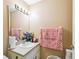 Bathroom showcasing a functional vanity and a large mirror at 7618 Majestic Pine Ct, Orlando, FL 32819
