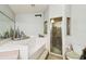 This bathroom features a tub, a shower, and a single window for lots of light at 7618 Majestic Pine Ct, Orlando, FL 32819