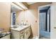 Bathroom featuring a neutral vanity with a large mirror and white cabinets and drawers at 7618 Majestic Pine Ct, Orlando, FL 32819