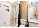 Bathroom showcasing shower-tub combo with white tile, and a functional vanity at 7618 Majestic Pine Ct, Orlando, FL 32819