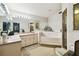 This bathroom has a large mirror, a built-in tub and pink countertops at 7618 Majestic Pine Ct, Orlando, FL 32819