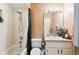 Clean bathroom with shower-tub combo, white tile, and updated vanity at 7618 Majestic Pine Ct, Orlando, FL 32819