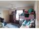 Cozy bedroom with bunk beds, ceiling fan, dresser, rug and neutral colors at 7618 Majestic Pine Ct, Orlando, FL 32819