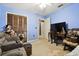 Blue bedroom with closet, and desk, enhanced by a bright ceiling fan and natural light at 7618 Majestic Pine Ct, Orlando, FL 32819