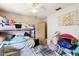 Bedroom with bunk beds, ceiling fan, and closet with a door at 7618 Majestic Pine Ct, Orlando, FL 32819