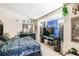 Bedroom with window bay, with a large bed and entertainment setup at 7618 Majestic Pine Ct, Orlando, FL 32819