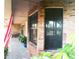 Covered porch with brick facade offering a comfortable outdoor living space at 7618 Majestic Pine Ct, Orlando, FL 32819
