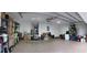 Bright and spacious garage with finished floor, offering functional storage options and parking at 7618 Majestic Pine Ct, Orlando, FL 32819