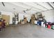 A well-lit garage with lots of shelving is great for storing many supplies and materials at 7618 Majestic Pine Ct, Orlando, FL 32819