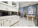 Open kitchen layout with ample counter space, connecting to the living area and breakfast nook at 7618 Majestic Pine Ct, Orlando, FL 32819