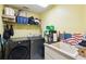 Functional laundry room with a washer, dryer, sink, and ample storage space at 7618 Majestic Pine Ct, Orlando, FL 32819