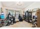 A room with natural light from the windows and a variety of furniture at 7618 Majestic Pine Ct, Orlando, FL 32819