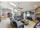 Living room showcasing the open layout, brick fireplace, and seamless flow to the kitchen at 7618 Majestic Pine Ct, Orlando, FL 32819