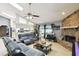 Spacious living room showcasing the open layout and skylights and a seamless flow to the kitchen at 7618 Majestic Pine Ct, Orlando, FL 32819