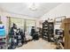 Bright living room space with display cabinet and a lot of personal items around the area at 7618 Majestic Pine Ct, Orlando, FL 32819