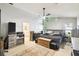 Spacious main bedroom with modern rustic decor, large bed, ceiling fan, carpet, and ensuite bathroom at 7618 Majestic Pine Ct, Orlando, FL 32819