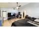 Spacious main bedroom with modern rustic decor, large bed, ceiling fan, carpet, ensuite bathroom, and walk-in closet at 7618 Majestic Pine Ct, Orlando, FL 32819