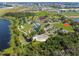 Aerial view of a vibrant park with playground, baseball field, trails, and lake access at 7618 Majestic Pine Ct, Orlando, FL 32819