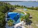 Aerial view of a colorful playground with shaded play structures and landscaped surroundings at 7618 Majestic Pine Ct, Orlando, FL 32819