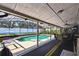 Relax in this screened in pool with a covered patio and plenty of space to lounge at 7618 Majestic Pine Ct, Orlando, FL 32819