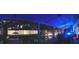 Beautiful screened-in pool with clear blue water with underwater lighting at night at 7618 Majestic Pine Ct, Orlando, FL 32819