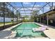 This beautiful screened-in pool features a clear water, tile trim, and a tanning deck with a large patio area at 7618 Majestic Pine Ct, Orlando, FL 32819