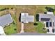 Aerial shot of a well-maintained home showcasing its roof, landscaping, and proximity to neighboring properties at 8443 Sw 109Th Pl, Ocala, FL 34481