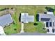 An aerial view of a home with a well-maintained lawn and a clean roof, showcasing the property's layout and curb appeal at 8443 Sw 109Th Pl, Ocala, FL 34481