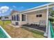 Charming backyard with a screened lanai and seating area, perfect for outdoor enjoyment at 8443 Sw 109Th Pl, Ocala, FL 34481