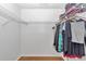 Walk-in closet featuring wire shelving and hanging storage, with hard-wood floors at 8443 Sw 109Th Pl, Ocala, FL 34481