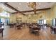 An expansive dining room offers ample seating options with rich wood floors and decorative lighting fixtures at 8443 Sw 109Th Pl, Ocala, FL 34481