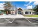 Inviting clubhouse with a stone facade, well-manicured landscaping, and a welcoming entrance at 8443 Sw 109Th Pl, Ocala, FL 34481