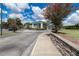 Well-maintained community center featuring a porte-cochere and colorful landscaping at 8443 Sw 109Th Pl, Ocala, FL 34481