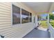 Inviting front porch with railing offers curb appeal and access to the home's entrance at 8443 Sw 109Th Pl, Ocala, FL 34481