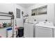 Functional laundry room with washer, dryer, and storage solutions at 8443 Sw 109Th Pl, Ocala, FL 34481