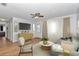 Bright living room with hardwood floors, ceiling fan, and stylish furnishings at 8443 Sw 109Th Pl, Ocala, FL 34481
