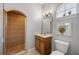 Tiled bathroom with a walk-in shower, sink and toilet at 8475 Eagles Loop Cir, Windermere, FL 34786
