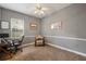 Well-lit bedroom featuring desk, chair, and ceiling fan at 8475 Eagles Loop Cir, Windermere, FL 34786