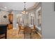 Breakfast nook with a chandelier and large windows offers natural lighting and a cozy atmosphere at 8475 Eagles Loop Cir, Windermere, FL 34786