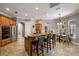 Spacious kitchen with center island, stainless steel appliances, and easy access to dining and living areas at 8475 Eagles Loop Cir, Windermere, FL 34786