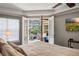 Bedroom with French doors leading to a screened patio and outdoor seating area at 8475 Eagles Loop Cir, Windermere, FL 34786